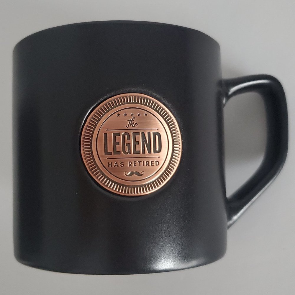 Retirement Gift Mug Large Black Copper Medallion Applique THE LEGEND HAS RETIRED